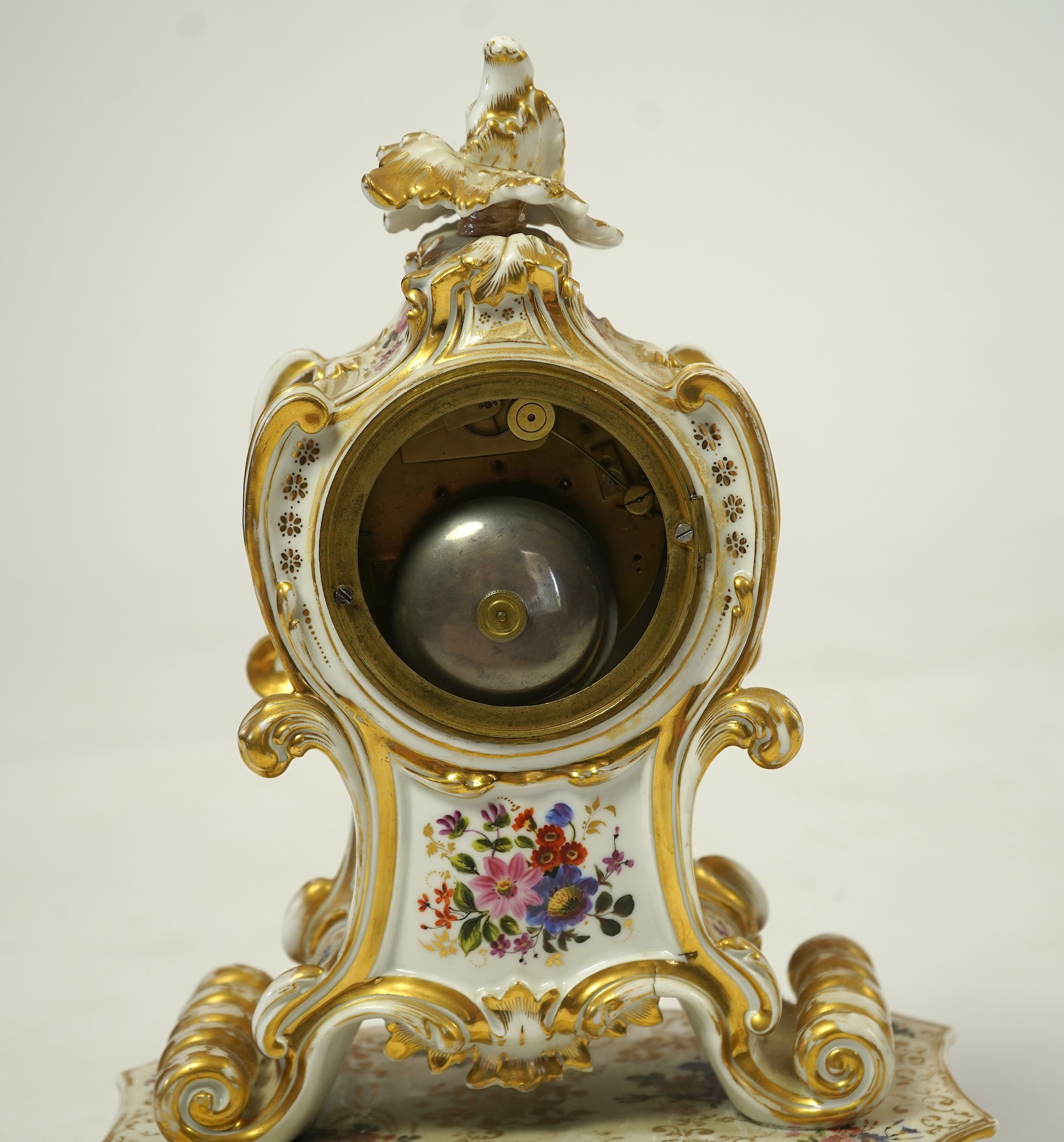 A mid 19th century French porcelain floral and gilt decorated clock, by Jacob Petit